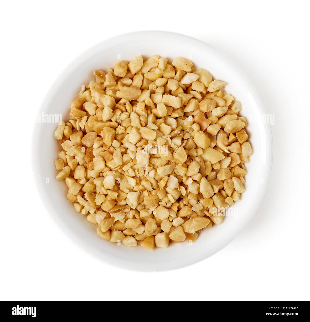Bowl of roasted crushed peanuts isolated on white background, top view Stock Photo