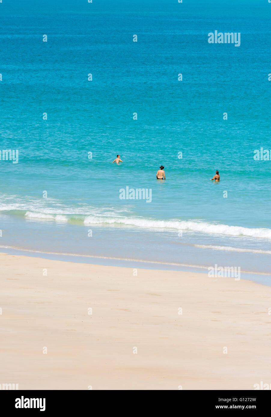 People playing in the sea at Cable Beach, Broome, Kimberley, Western Australia Stock Photo