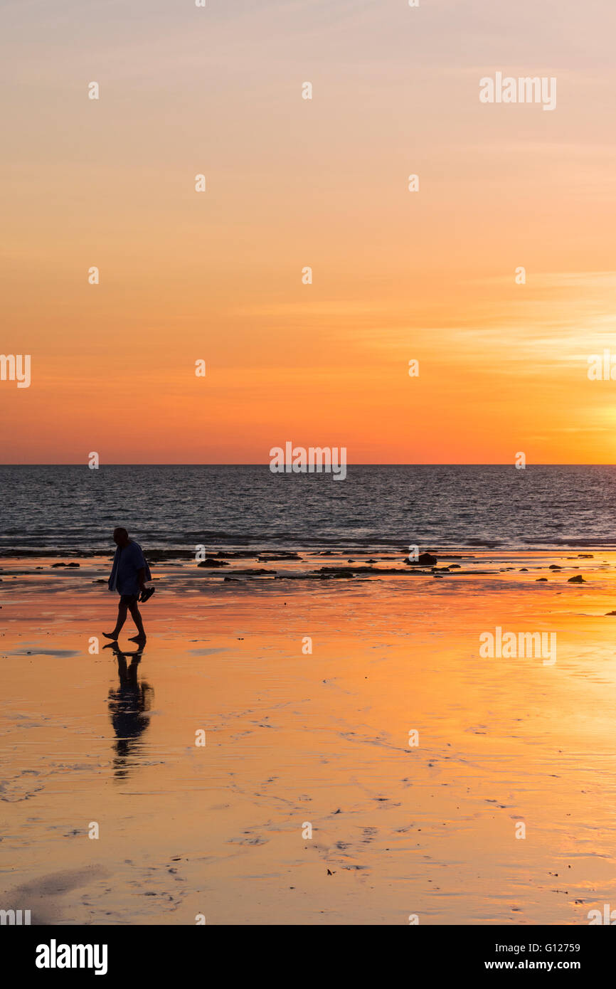 Lone man walks along Cable Beach at sunset, Broome, Kimberley, Western