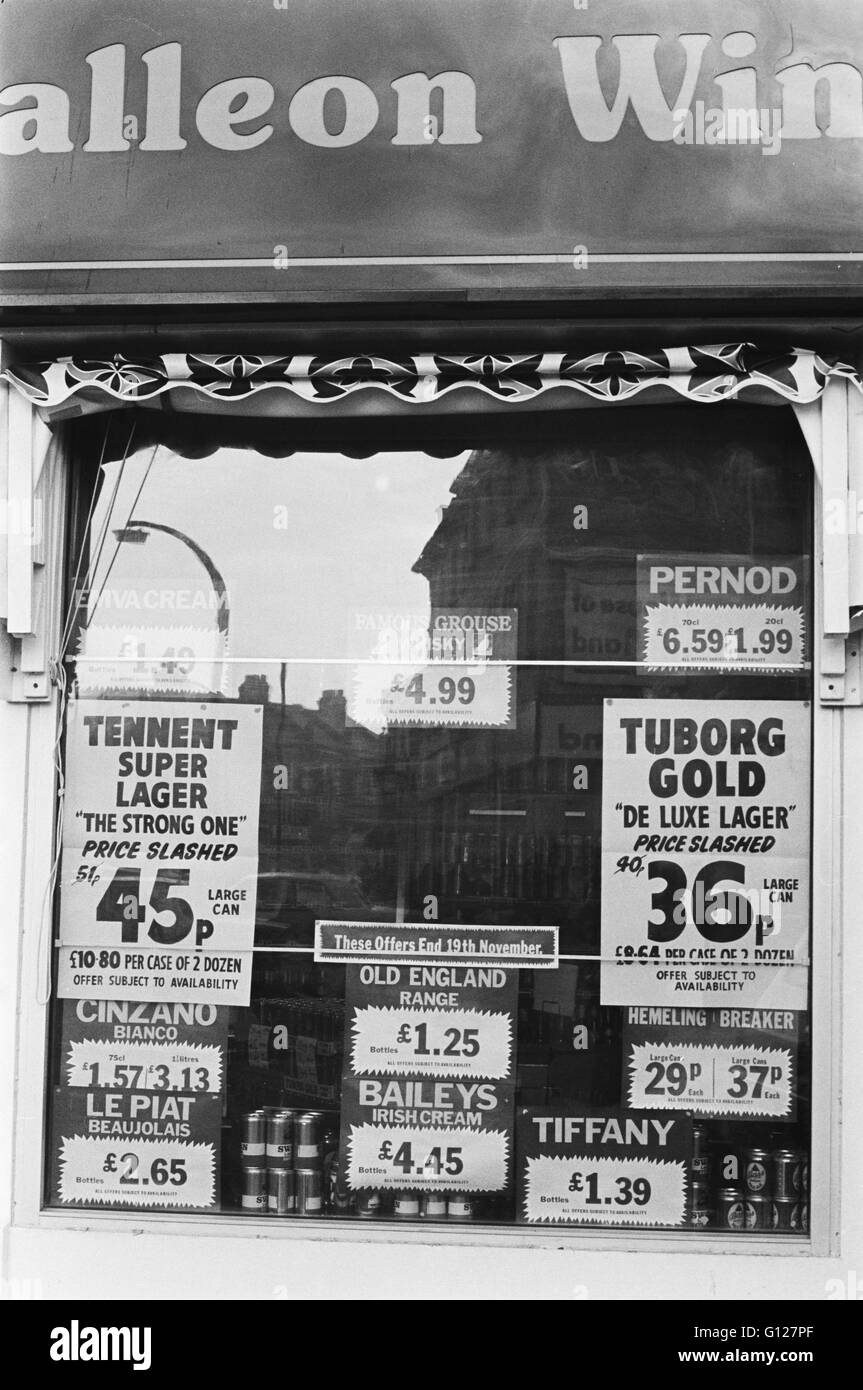 Archive image of Galleon Wines off-licence window showing drink prices from 36p for a can of Tuborg lager, Lambeth, London, England 1979  London 1970s Stock Photo
