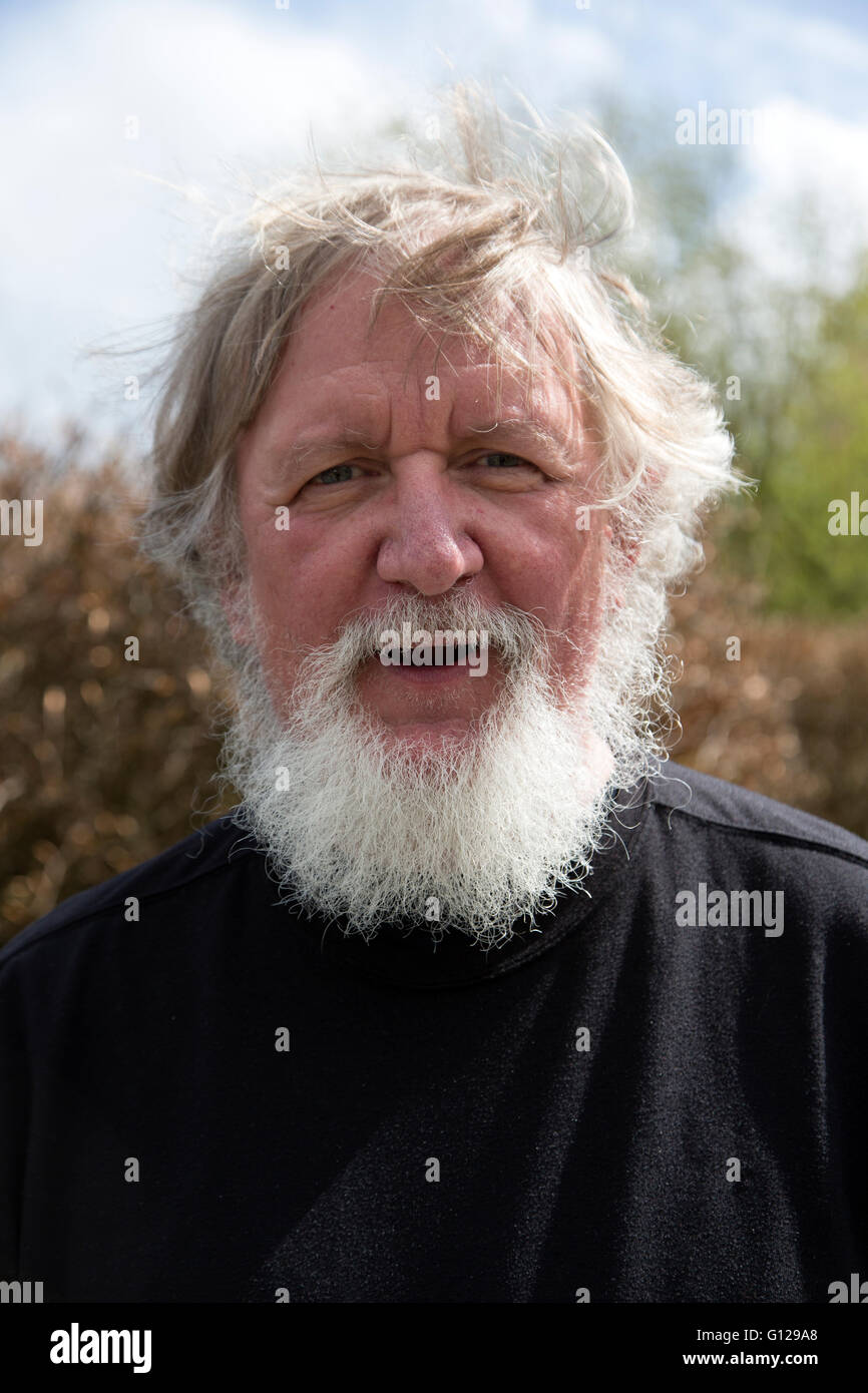 Older man with white / Grey beard and long white hair Stock Photo