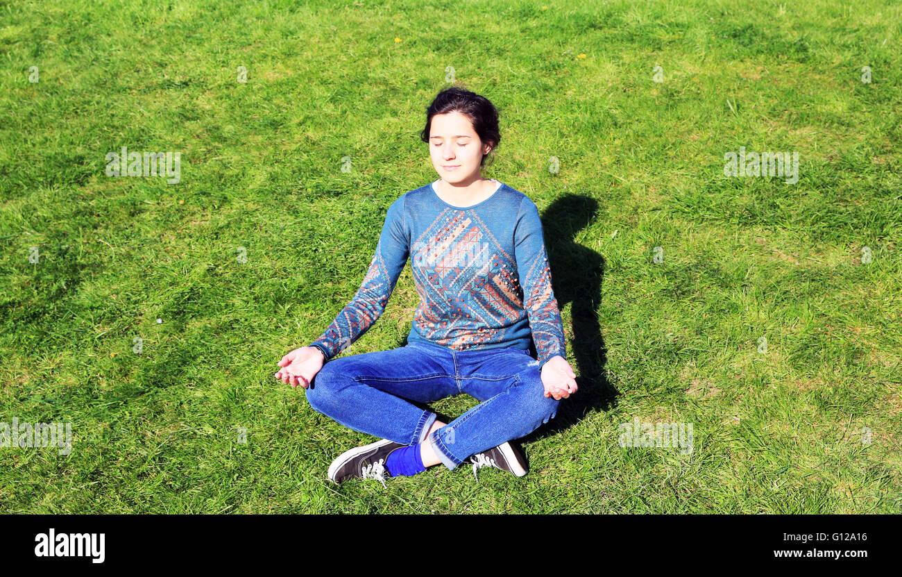 Beautiful woman relaxing in the park Stock Photo - Alamy
