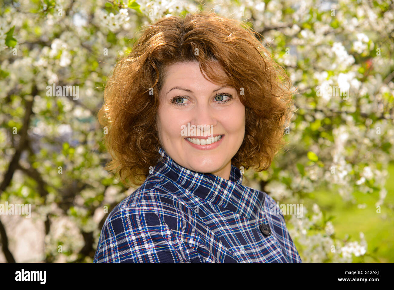 Portrait of woman in cherry garden in spring Stock Photo - Alamy