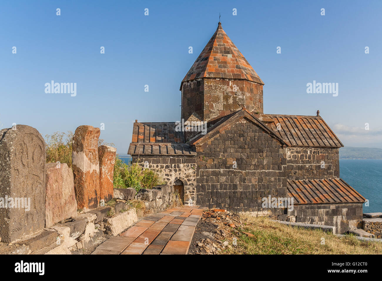 Church on a hilltop and Sevan lake in Armenia Stock Photo