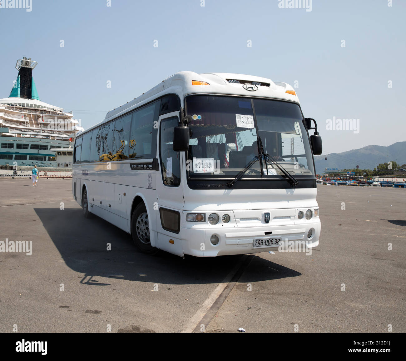 A tour coach arrives on the quayside in Nha Trang Vietnam Stock Photo
