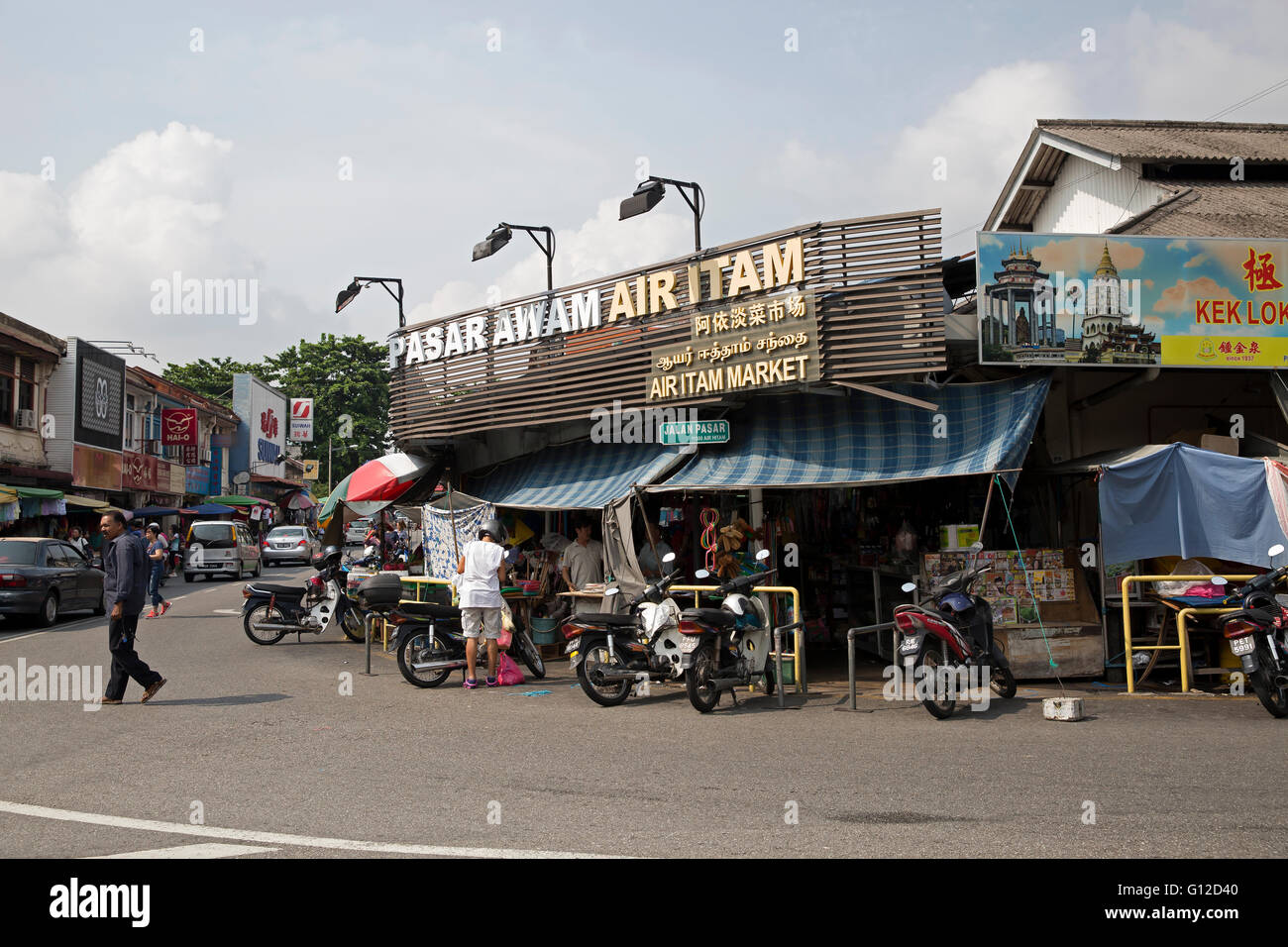 Motorbikes parked outside local shops in Penang Malaysia Stock Photo Alamy