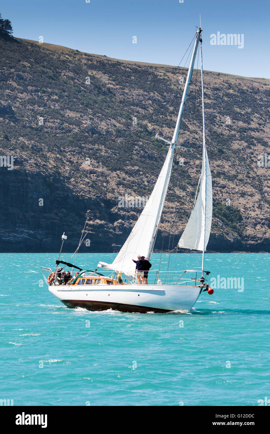 Yacht under sail, Akaroa Harbour, New Zealand Stock Photo Alamy