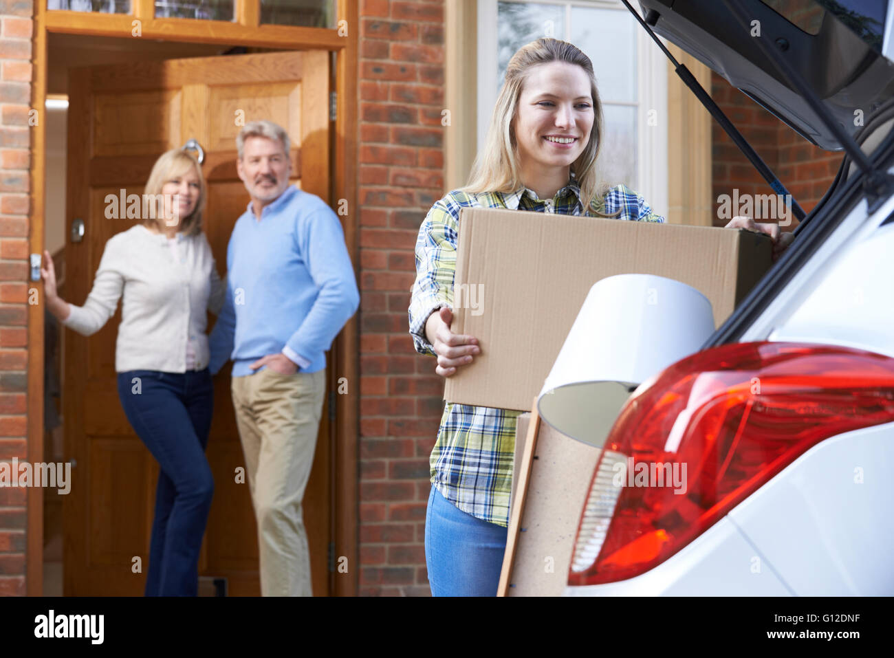 Adult Daughter Moving Out Of Parent's Home Stock Photo