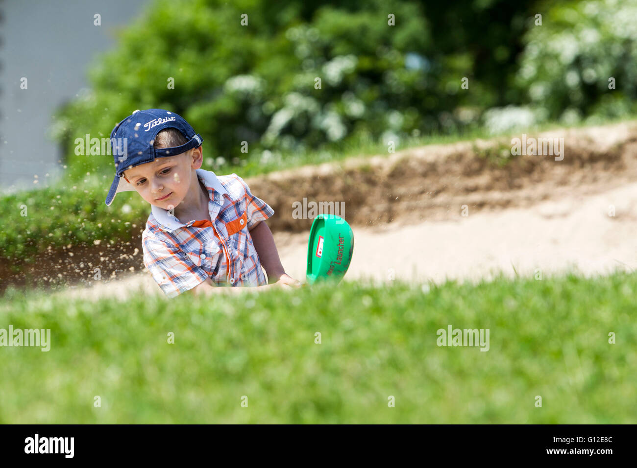 young boy playing golf Stock Photo