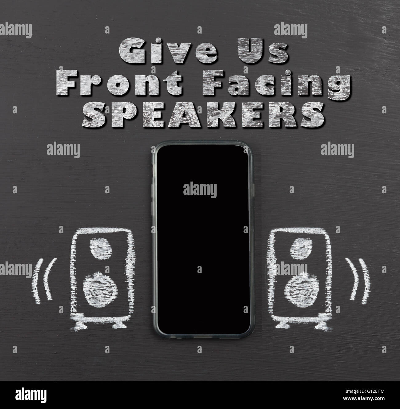 Front facing speakers on mobile phone concept hand drawn with chalk on blackboard with text. Stock Photo