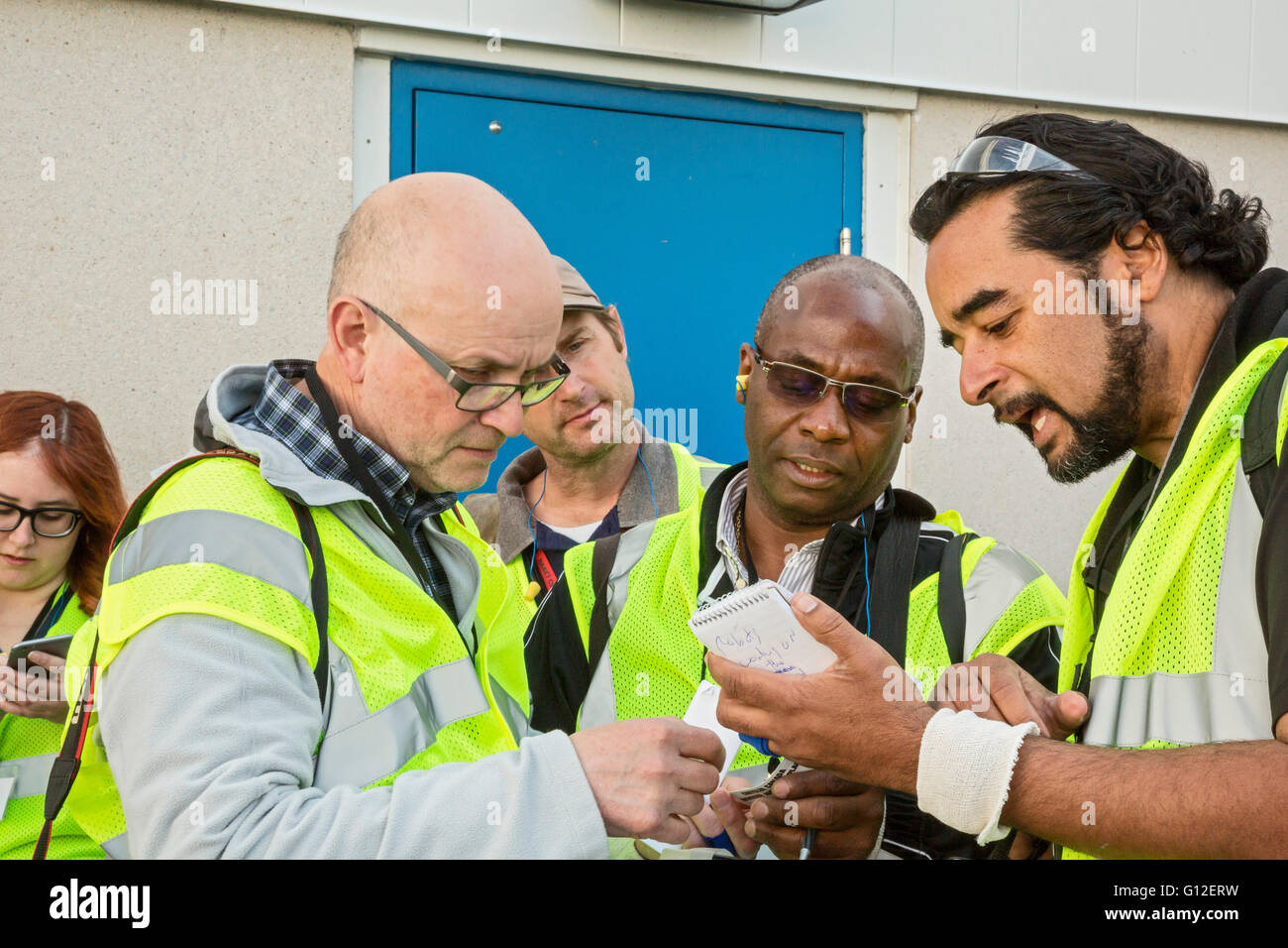 Windsor, Ontario Canada - Photographers compare notes during a tour of Fiat Chrysler Automobiles' Windsor Assembly Plant. Stock Photo