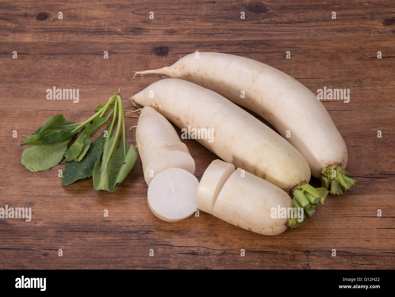 Daikon radish on the wood background Stock Photo
