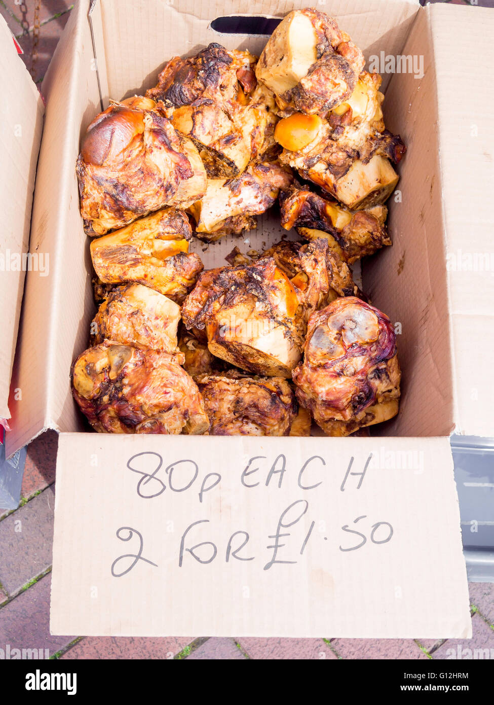 Dog treats knuckle bones for sale in a weekly market priced Stock Photo