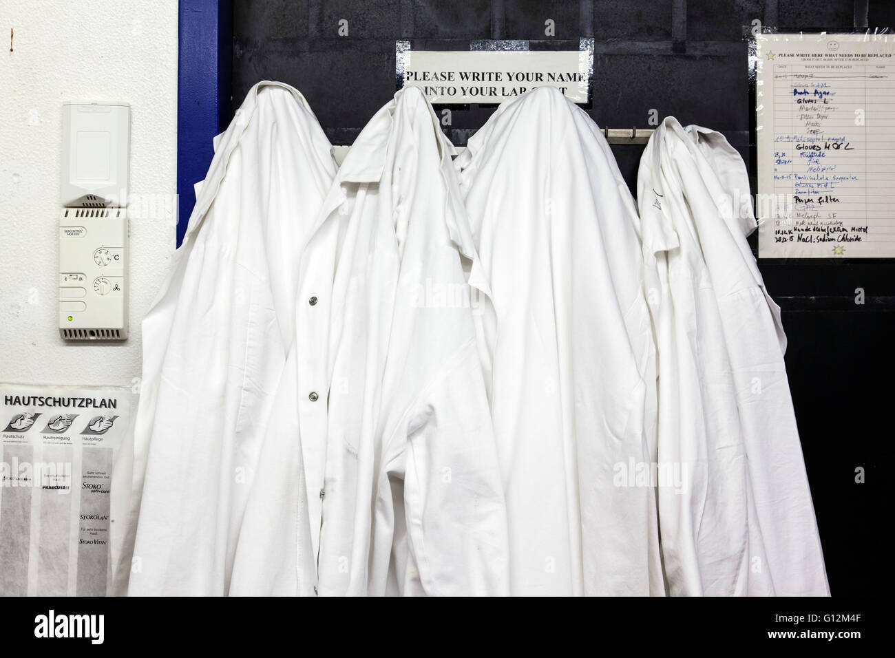 White lab coats on the hook Stock Photo