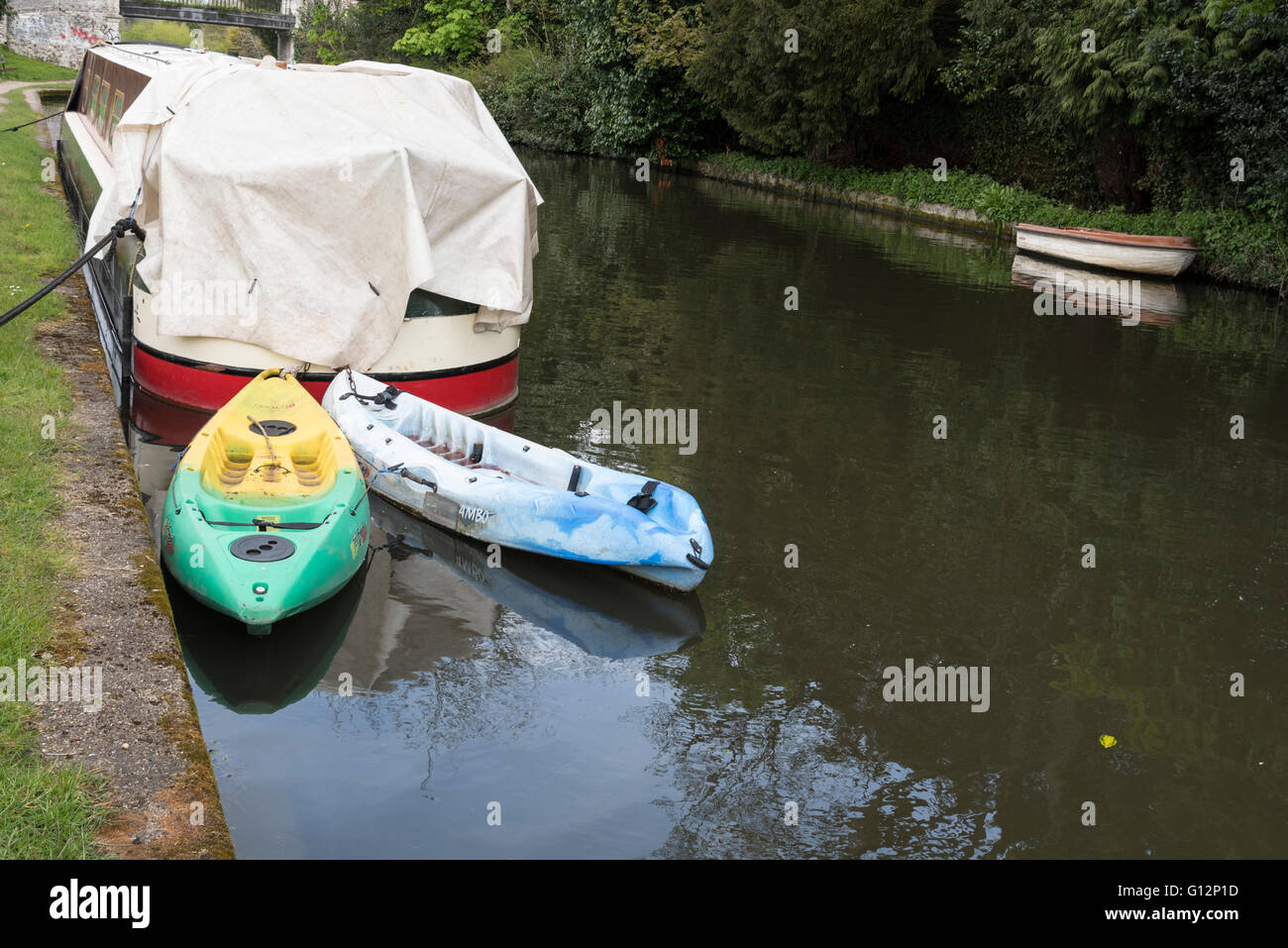 Moored canoes on the Grand Union Canal UK Stock Photo
