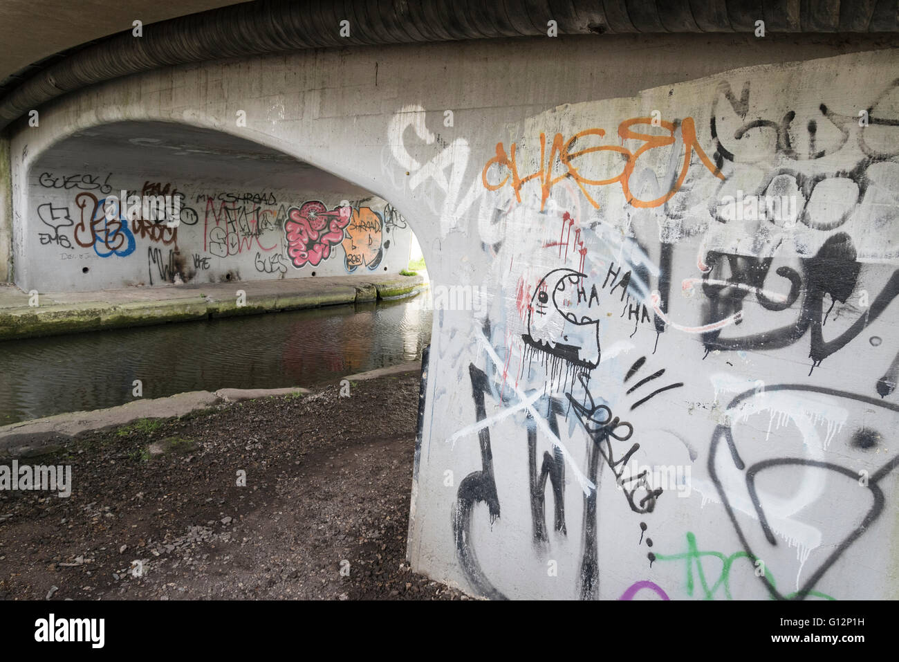 Graffiti on wall of bridge over the Grand Union Canal in Hertfordshire, UK. Stock Photo