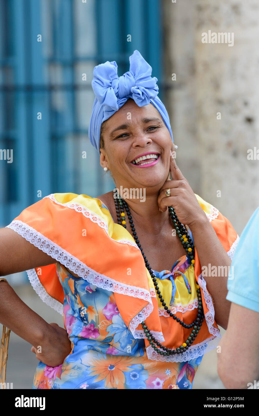 Cuban woman wearing traditional costume in the Plaza de la Catedral, Old Havana, Havana, Cuba Stock Photo