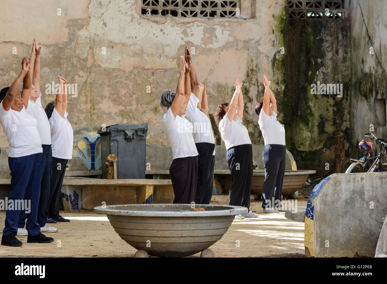 A group of elderly Cubans practice Tai Chi in a small park in Central Havana, Havana, Cuba Stock Photo
