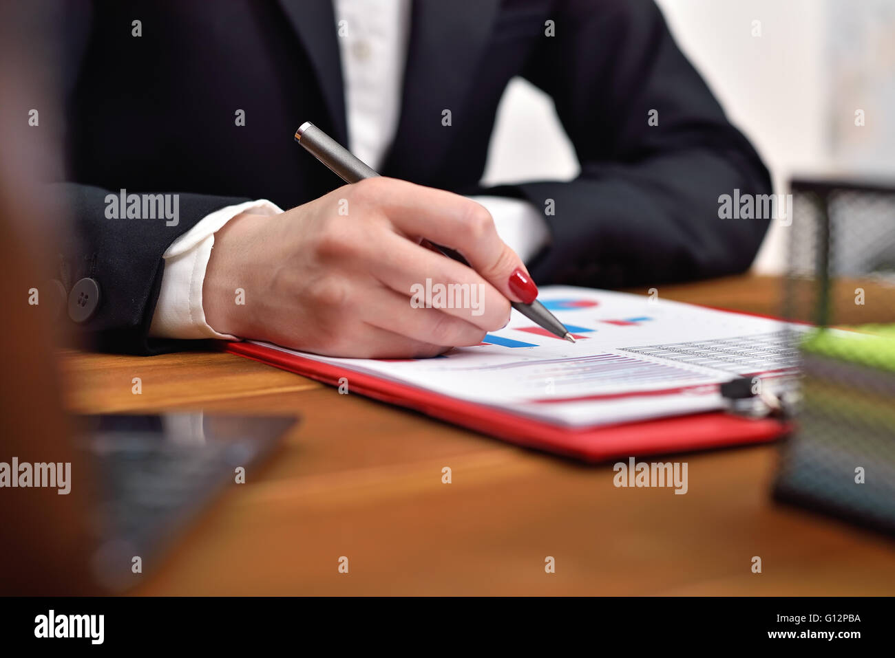 businesswoman checks the start up report. close up Stock Photo