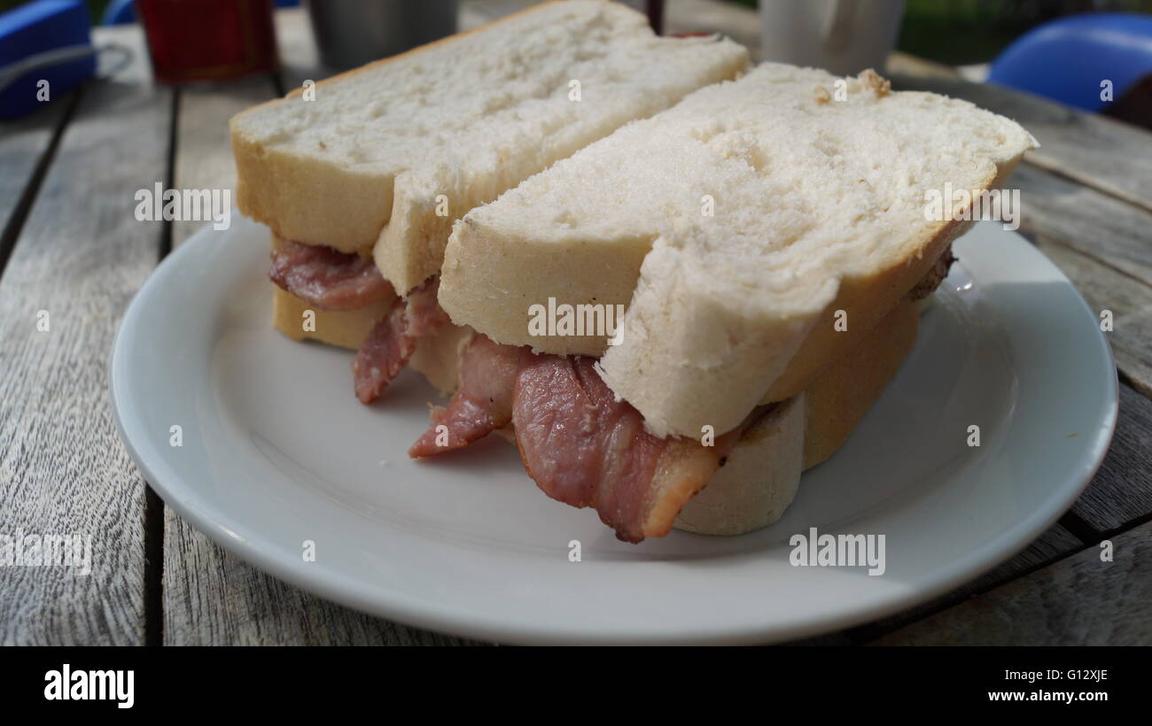 Bacon sandwich on doorstop white bread Stock Photo Alamy
