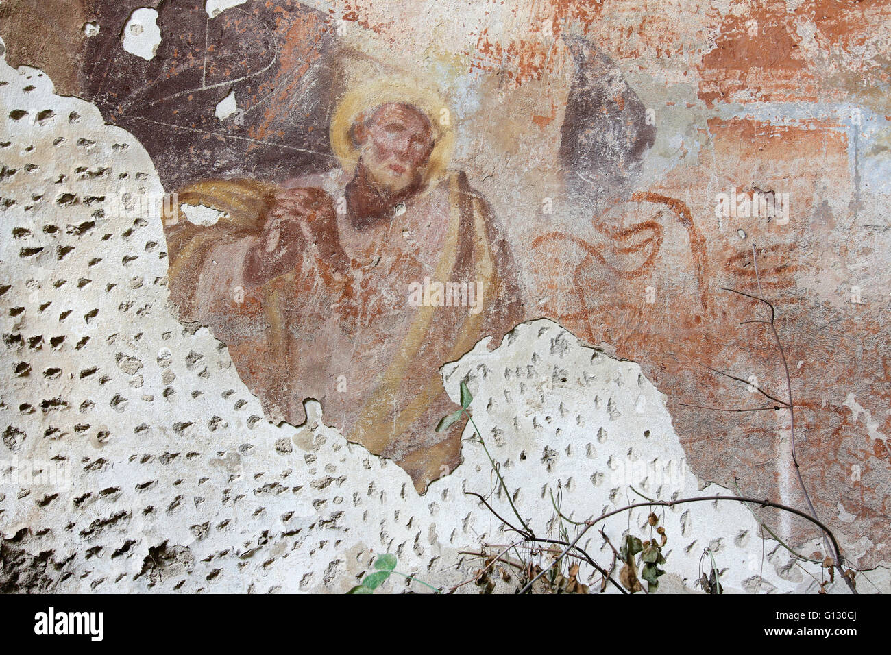 Praying saint - mural painting in the ruins of the church of Saint Gallus Stock Photo