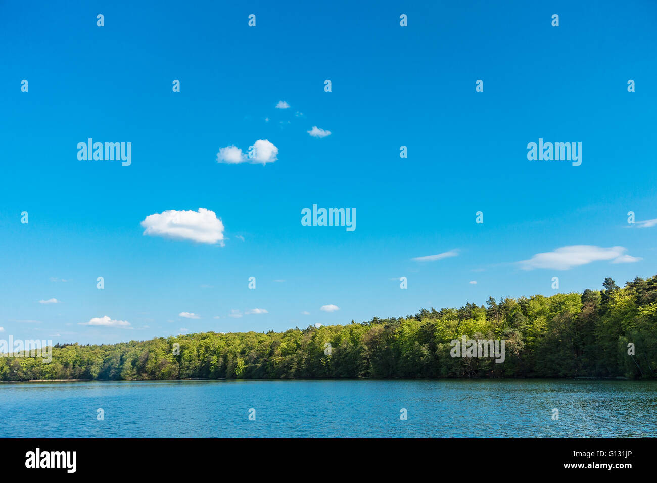 Landscape on a lake with blue sky Stock Photo - Alamy
