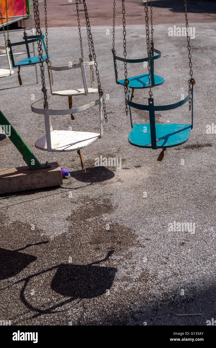 Old fashioned fairground swings ride, deserted Stock Photo: 103945379 ...