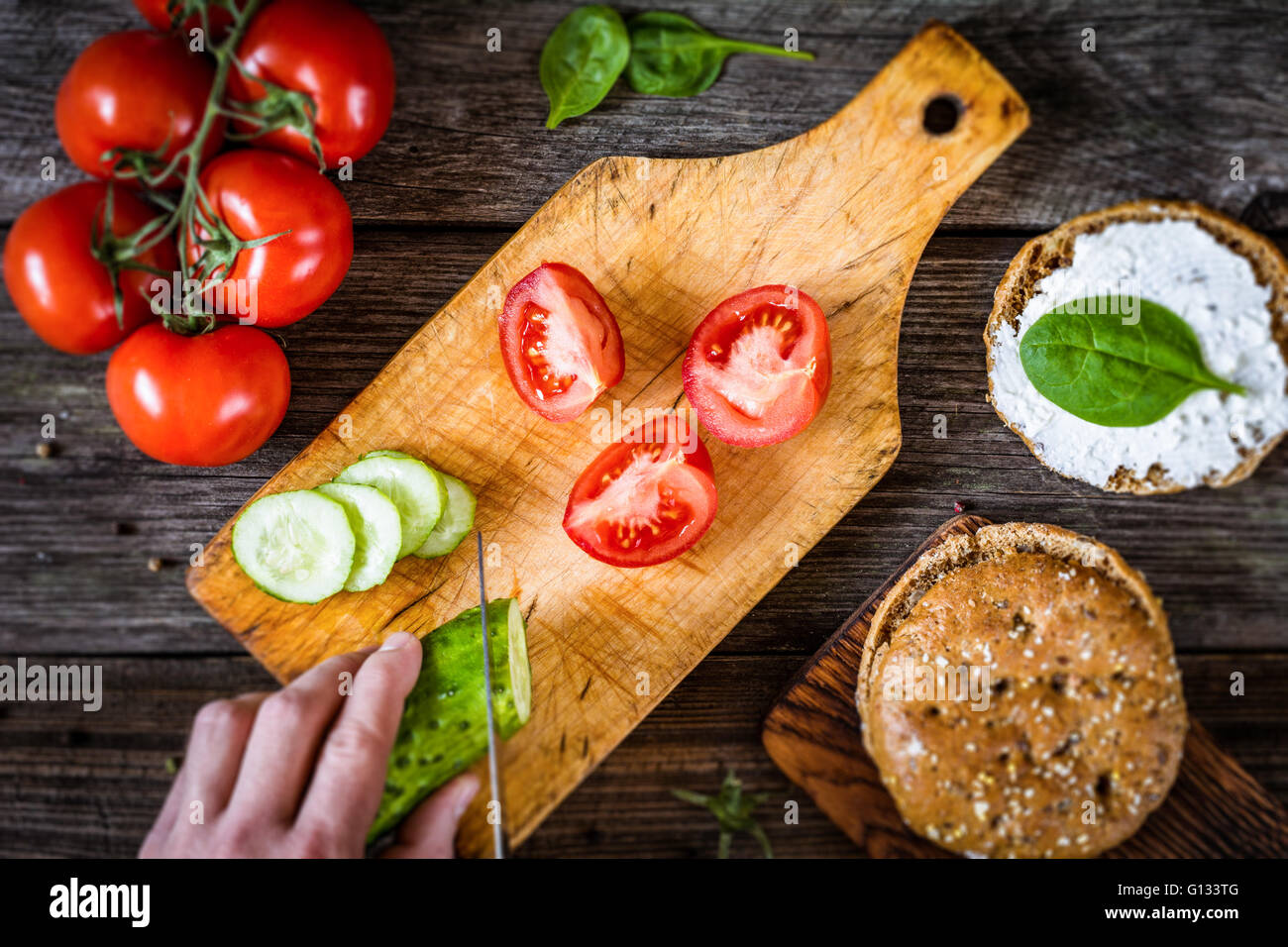 Chef cutting vegetables for salad. Process of cutting vegetables to