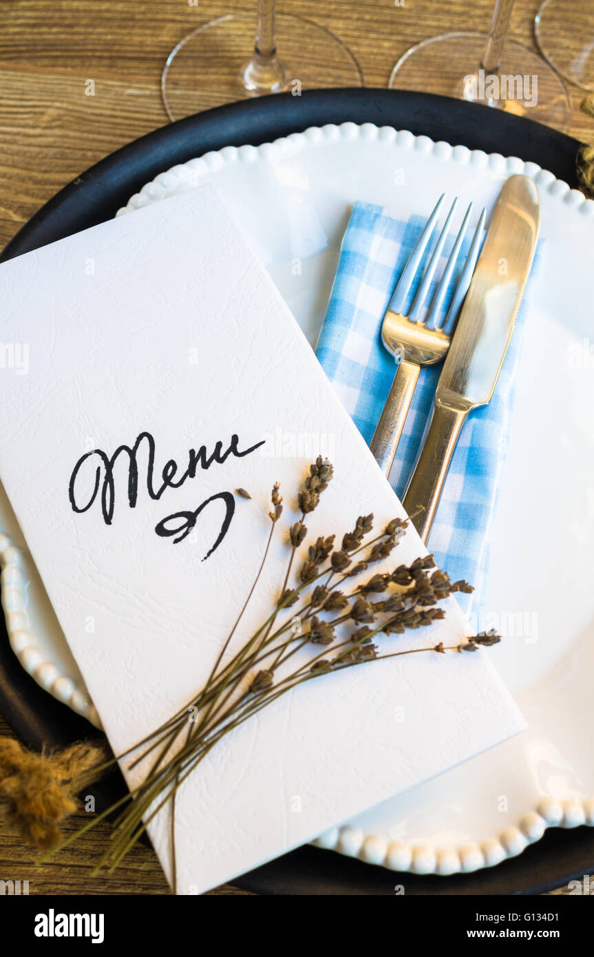 Table setting in rustic style with Menu Stock Photo - Alamy