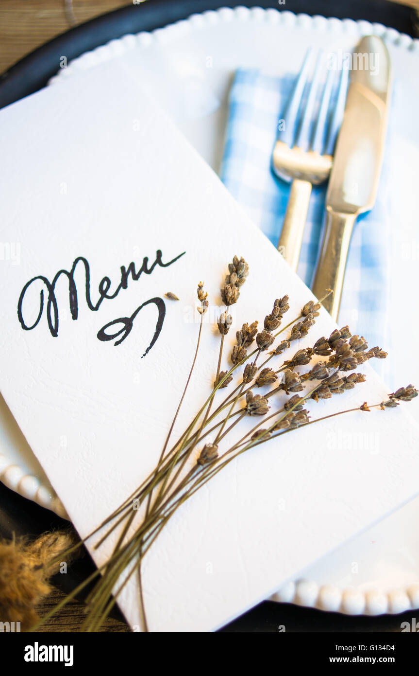 Table setting in rustic style with Menu Stock Photo - Alamy