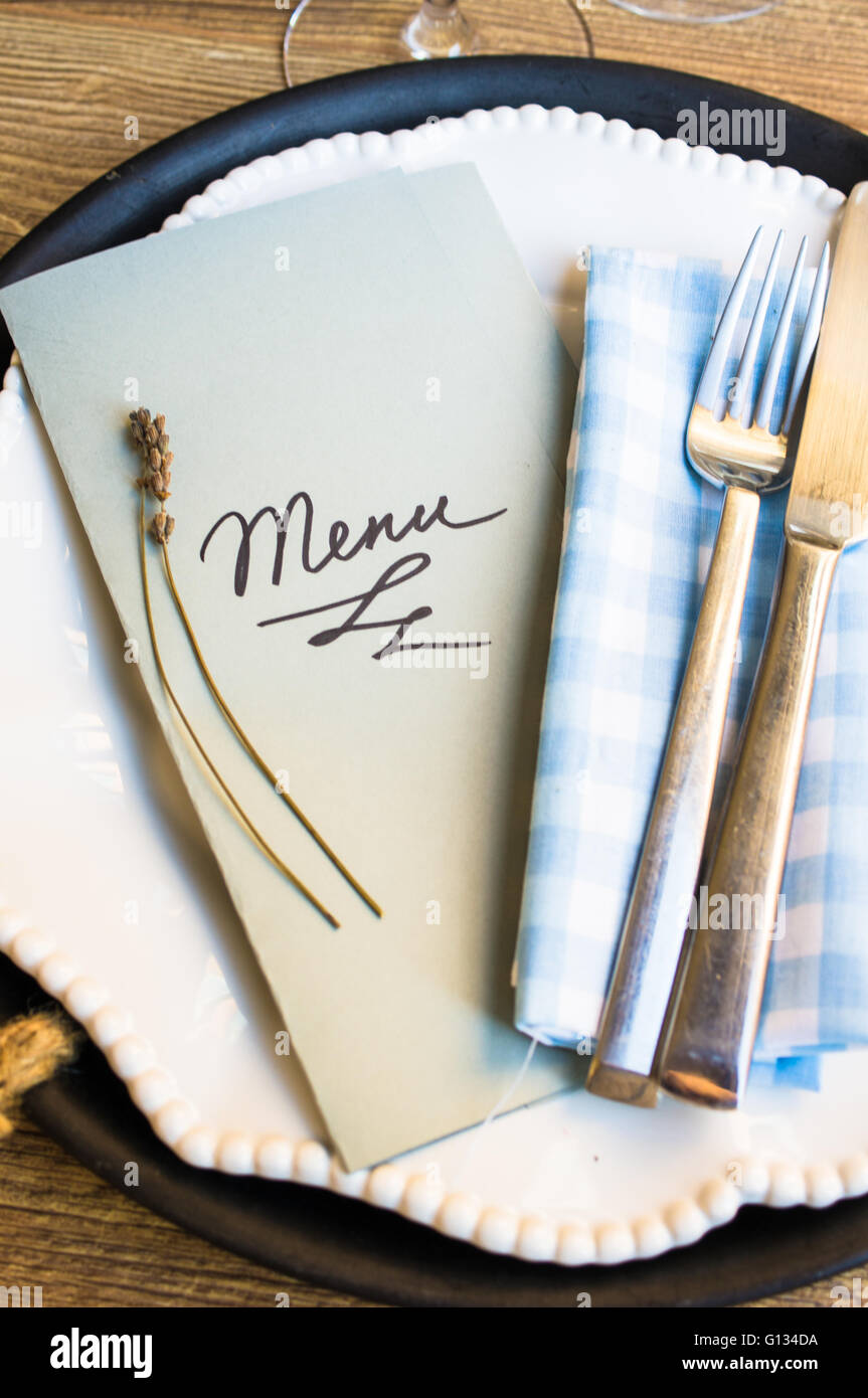 Table setting in rustic style with Menu Stock Photo - Alamy