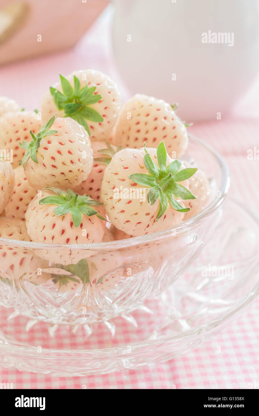Pineberries or Hula Berries a hybrid strawberry with a pineapple flavor white flesh and red seeds Stock Photo