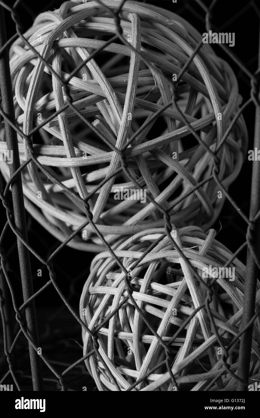 Abstract photograph featuring wire and spherical balls of twigs. Stock Photo