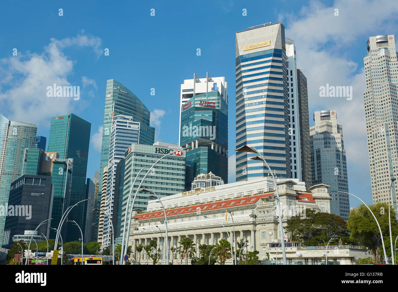 The Fullerton Hotel With The Singapore Business District Skyline Behind. Stock Photo