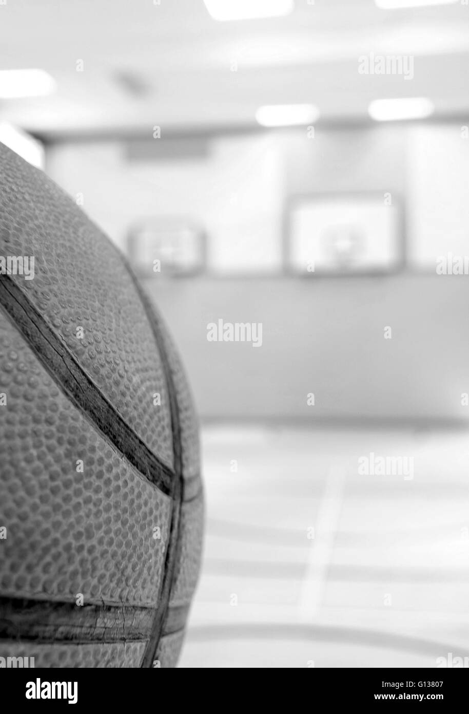 Basketball concept image, ball and baskets in a school gymnasium 8th May 2016 Stock Photo
