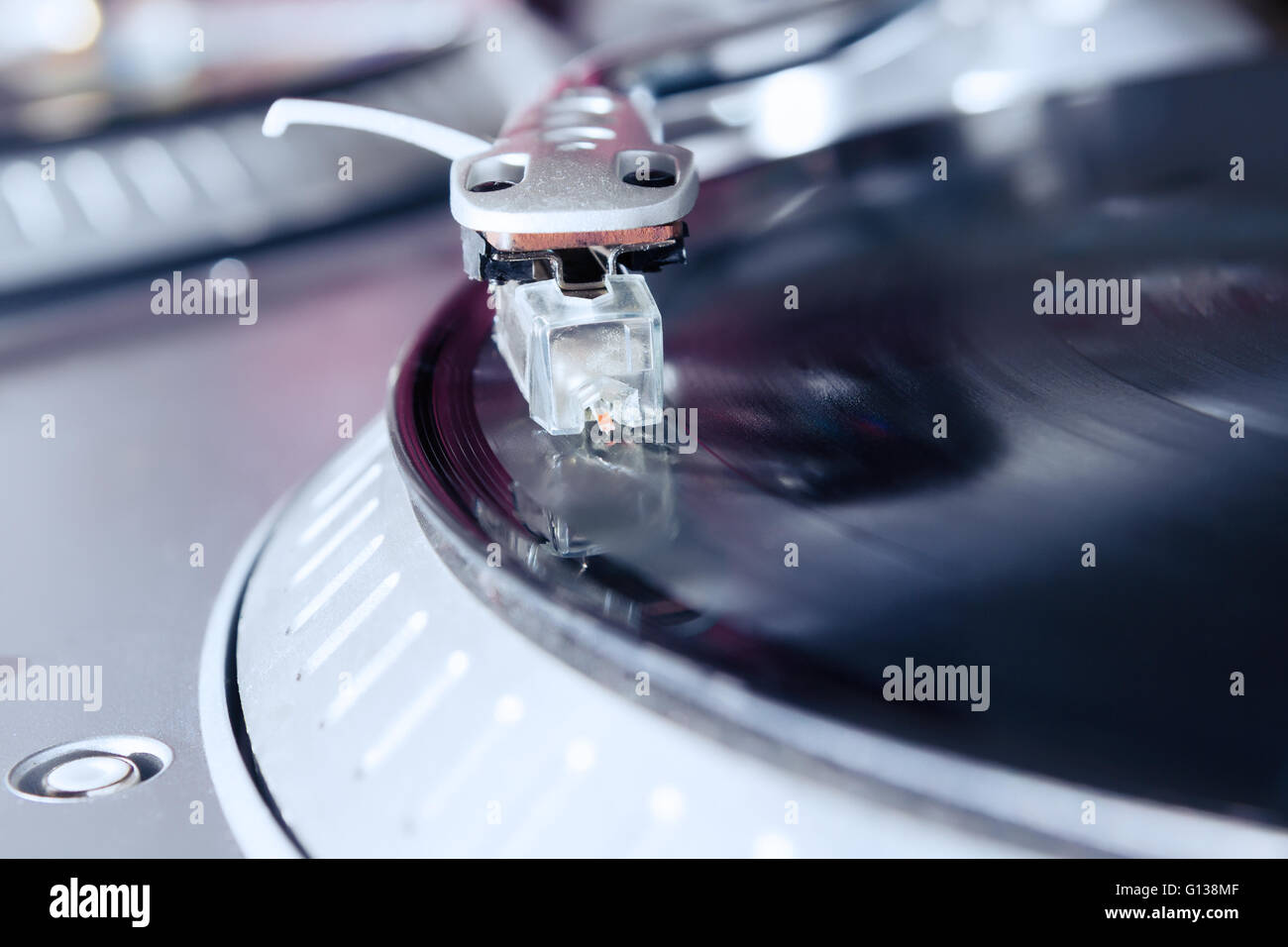 Turntable playing vinyl record with music. Close up, macro photo ...