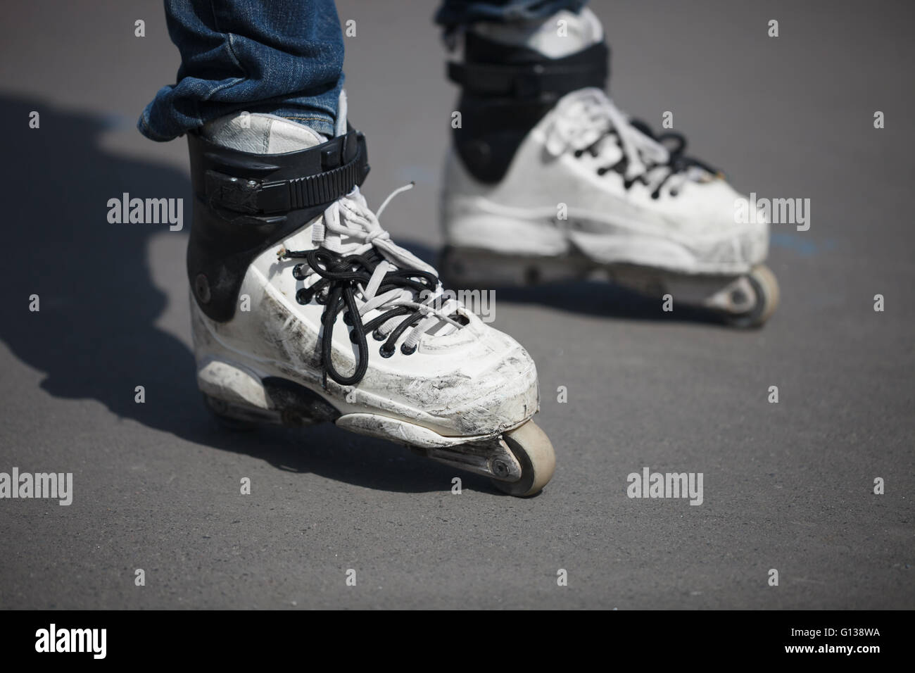 Rollerblader wearing professional extreme inline rollerblades made for tricks grinding and