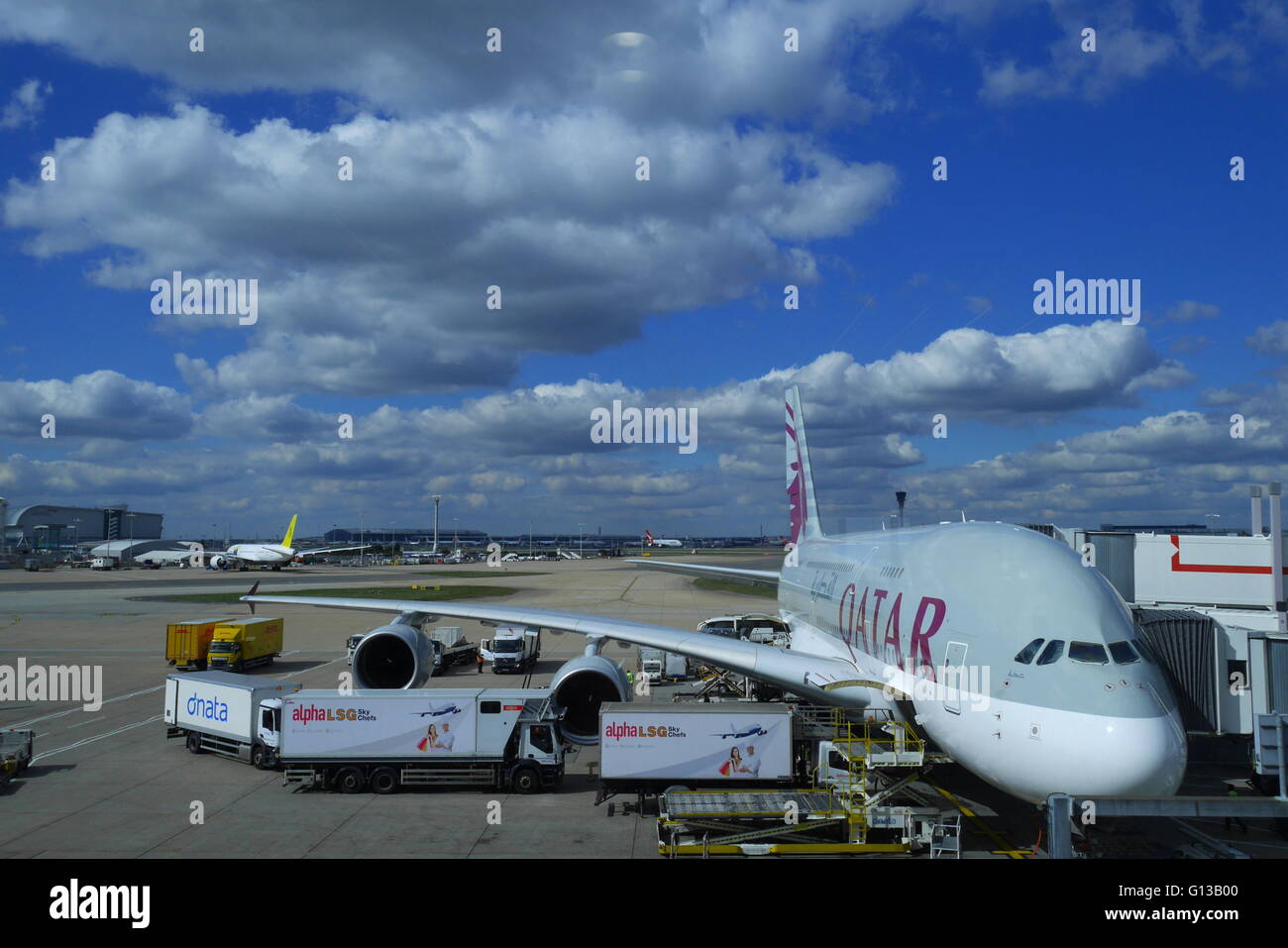 Qatar Airways Airbus A380-800 being loaded on the stand at London Heathrow Airport Stock Photo