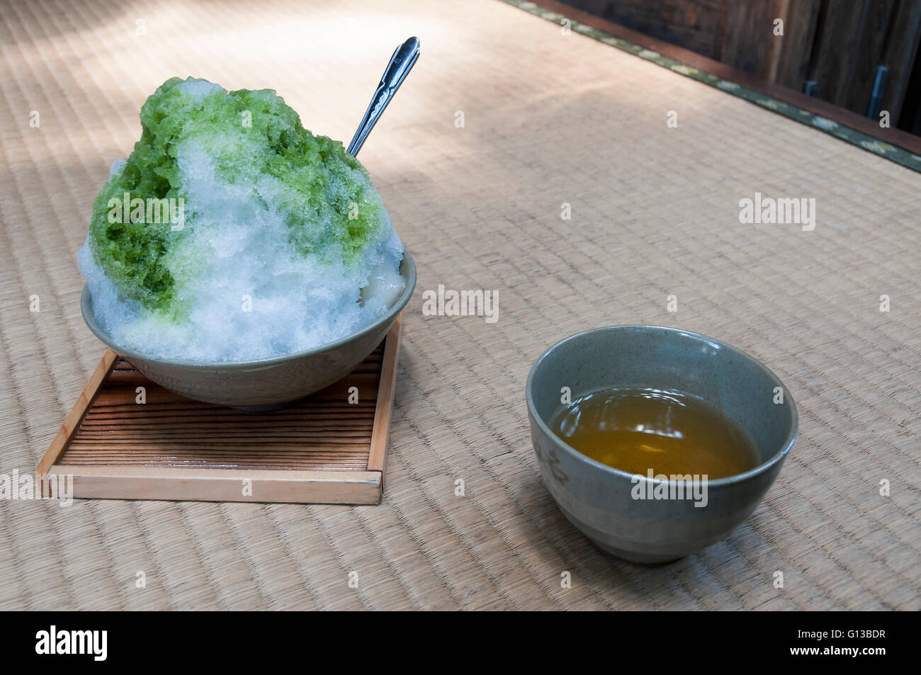 Japanese dessert - snow with matcha tea on a rice tatami Stock Photo