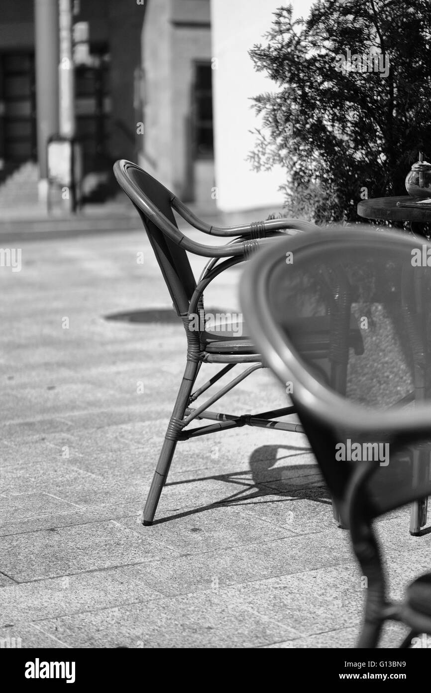 chairs outside pavement cafe Stock Photo