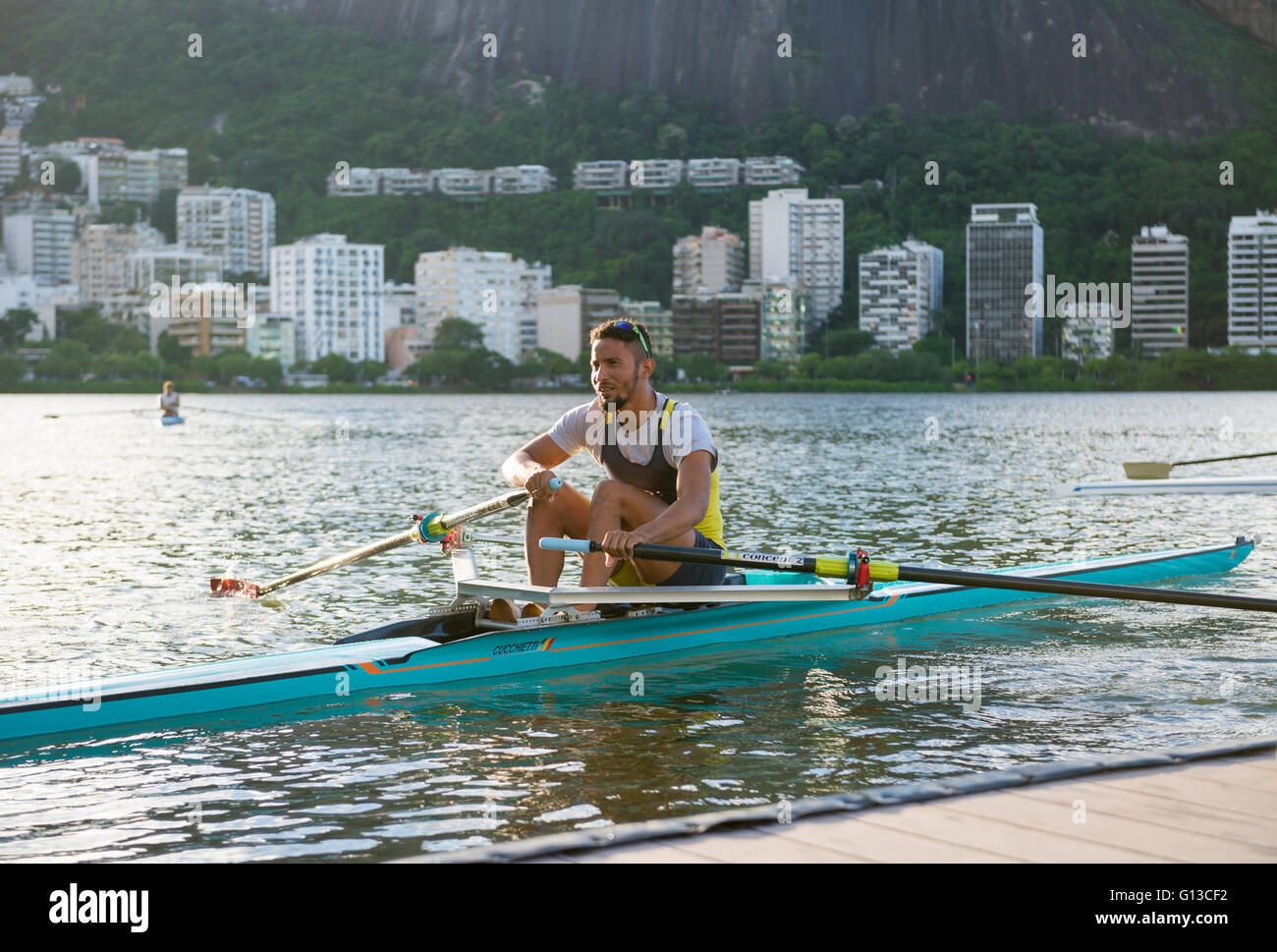 RIO DE JANEIRO - APRIL 1, 2016: A young Brazilian rower launches his ...