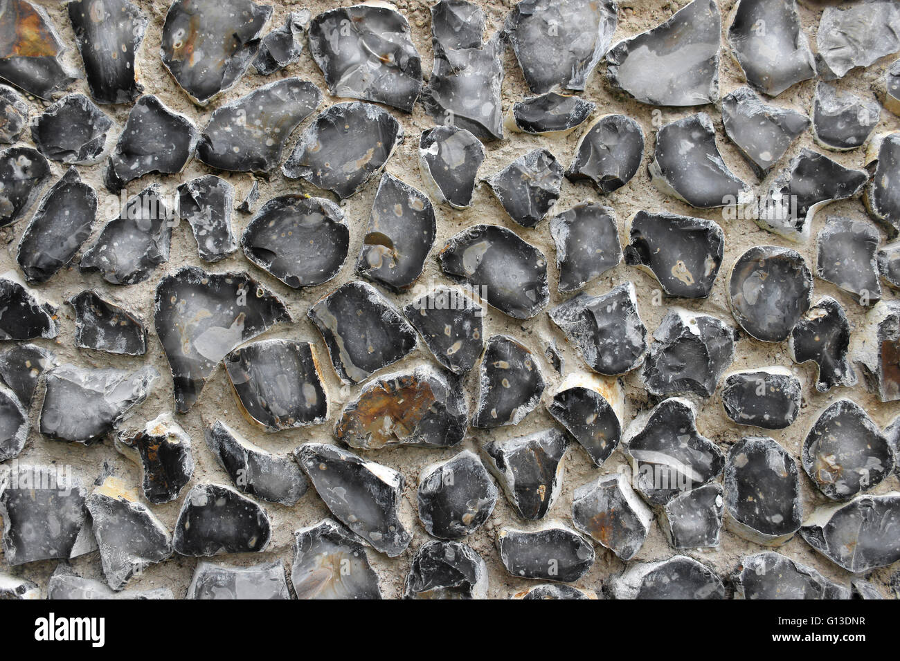 Napped Flints Used As A Building Material In A Norfolk (UK) Building's Wall Stock Photo