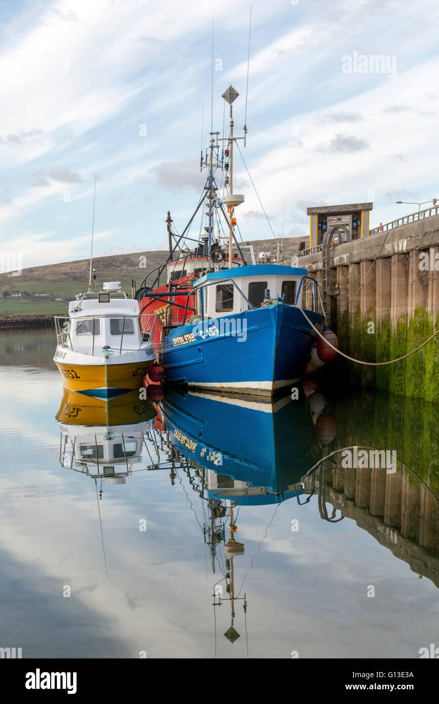 Early morning tranquility offering scenic reflections at Dingle harbor, County Kerry, Dingle Bay, Munster, Republic of Ireland. Stock Photo