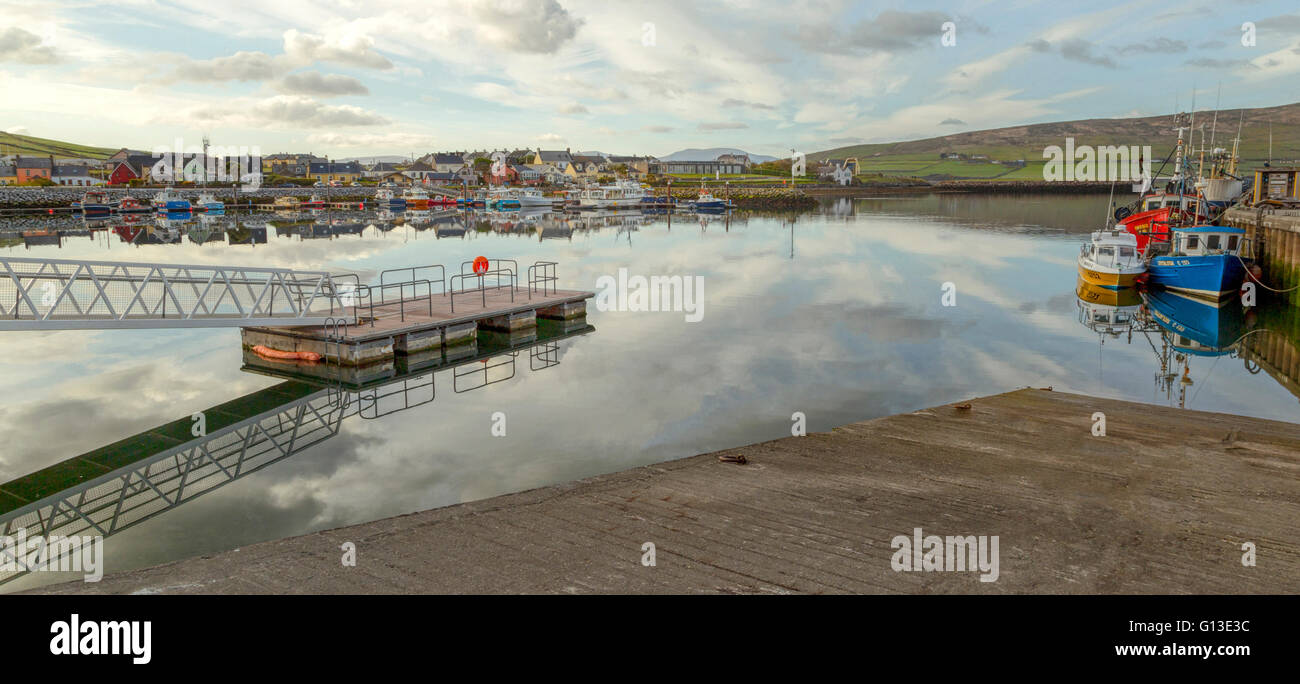 Early morning tranquility offering scenic reflections at Dingle harbor, County Kerry, Republic of Ireland. Stock Photo