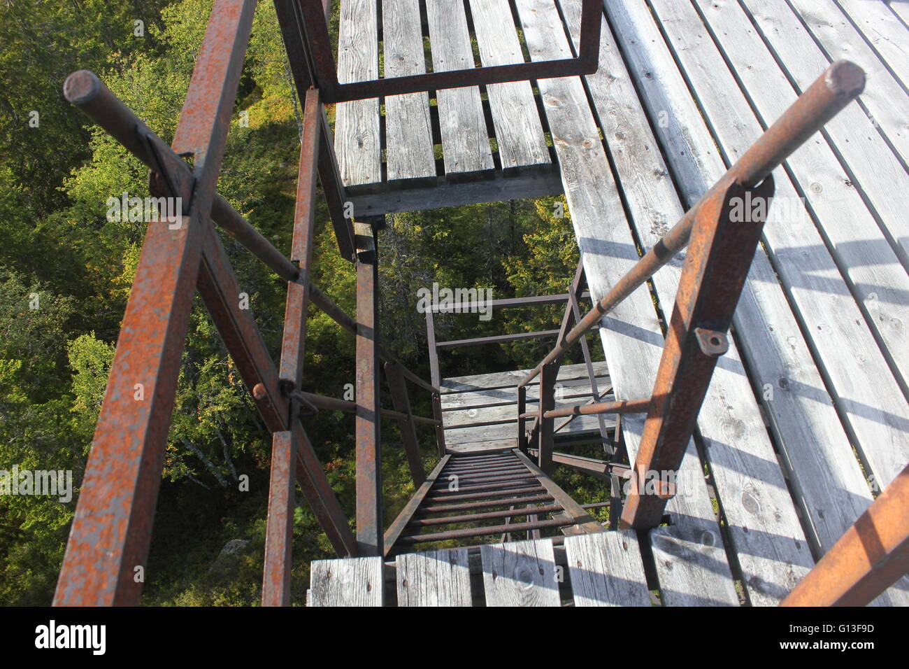 Looking down on steep and rusty ladder steps Stock Photo Alamy