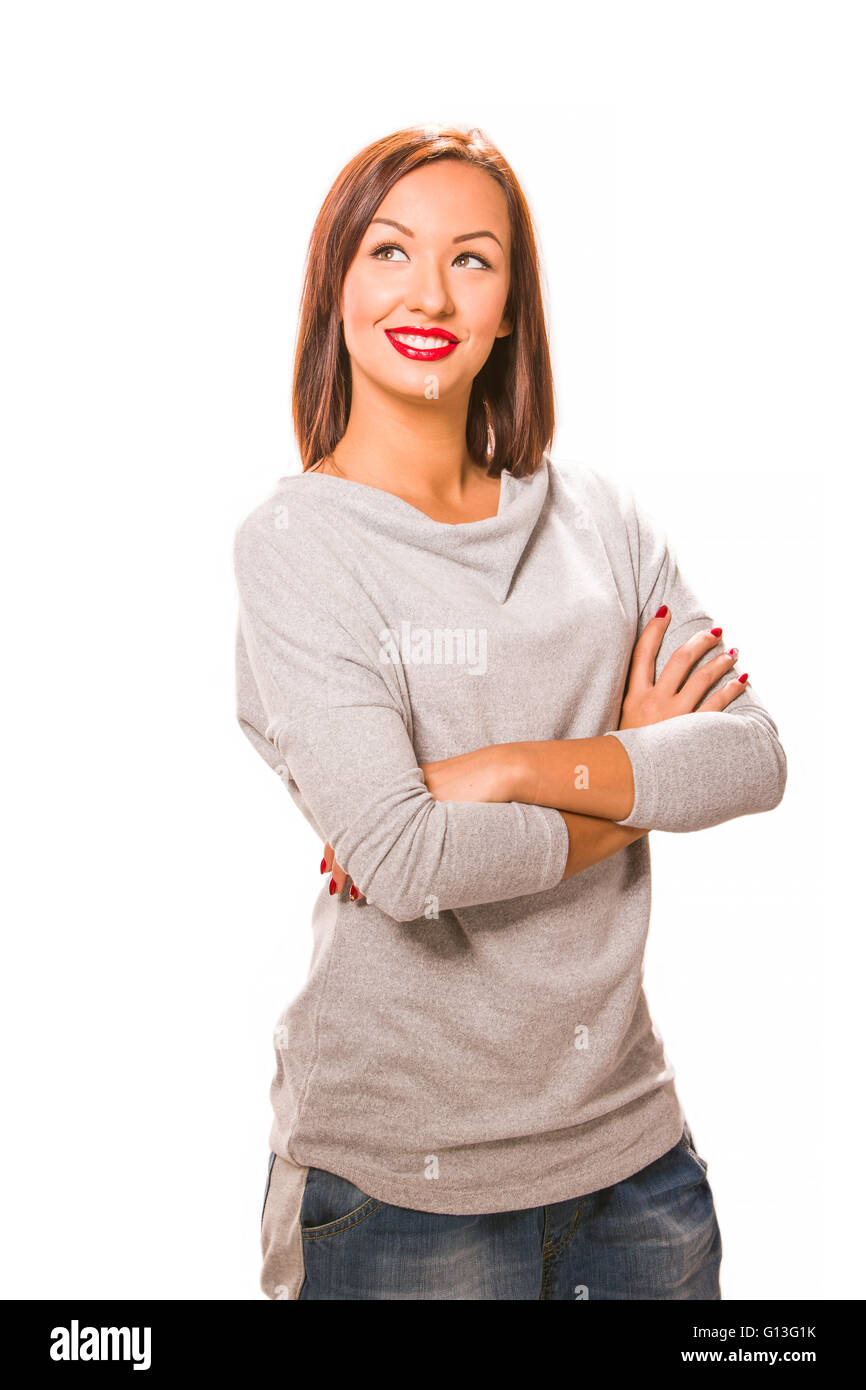 Brown hair beautiful woman with cross hands wearing grey shirt and jeans. Stock Photo