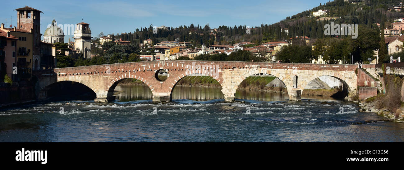 Panorama of Ponte di Pietra (Stone Bridge) in Verona, an ancient roman bridge over Adige River Stock Photo