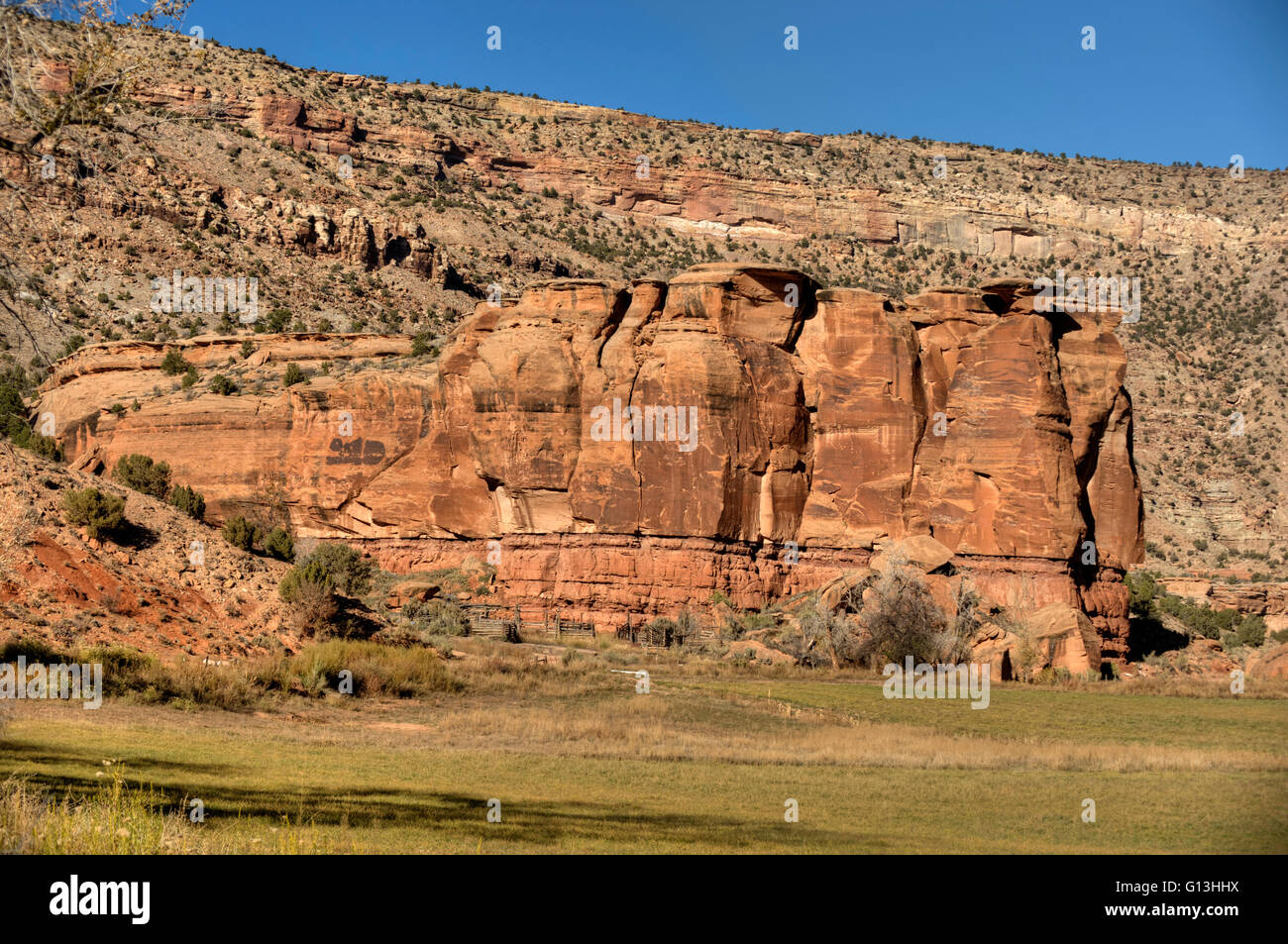 Bluffs of (bottom to top): Chinle Formation mudstone, Wingate Formation sandstone, and Entrada Formation Sandstone Stock Photo
