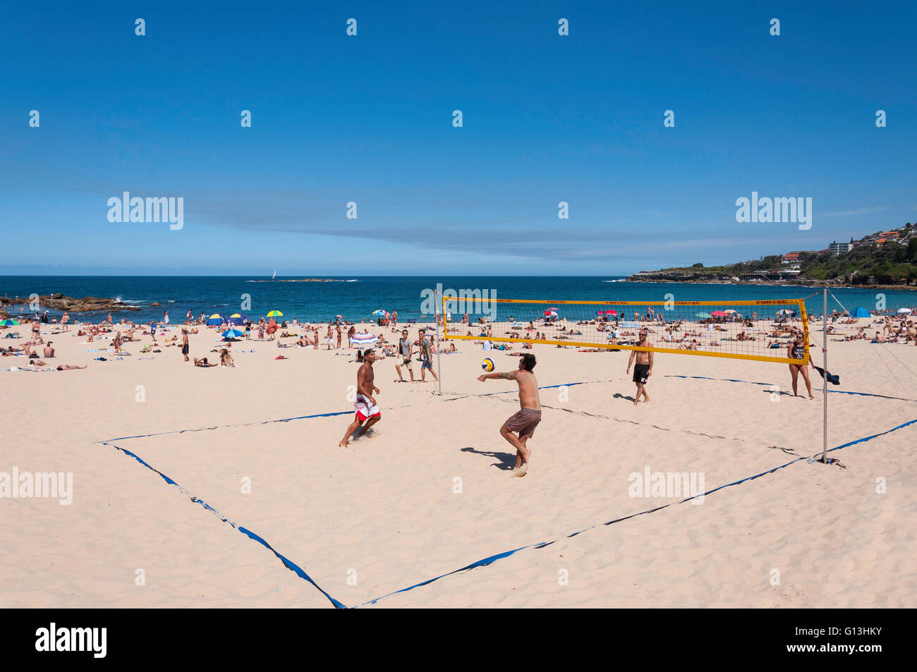 Men playing beach volleyball on Coogee Beach, Coogee, Sydney, New South Wales, Australia Stock Photo