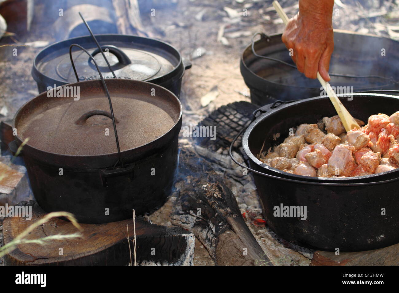 Cast Iron Dutch Oven On Wooden Background With Lid Lifter Stock Photo -  Download Image Now - iStock